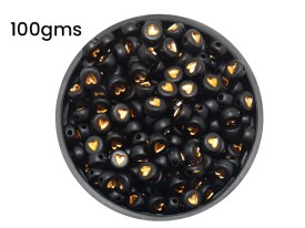 Cuentas plasticas pastilla negra corazon dorado 